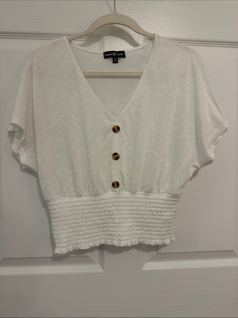 Almost Famous White V-Neck Smocked Hem Crop Top with Tortoiseshell Buttons